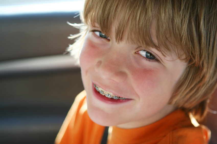 Boy with orthodontic braces